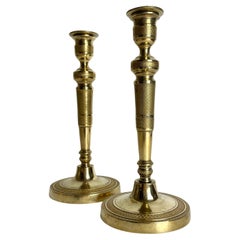 Elegant pair of Empire Candlesticks in gilt bronze from the 1820s.