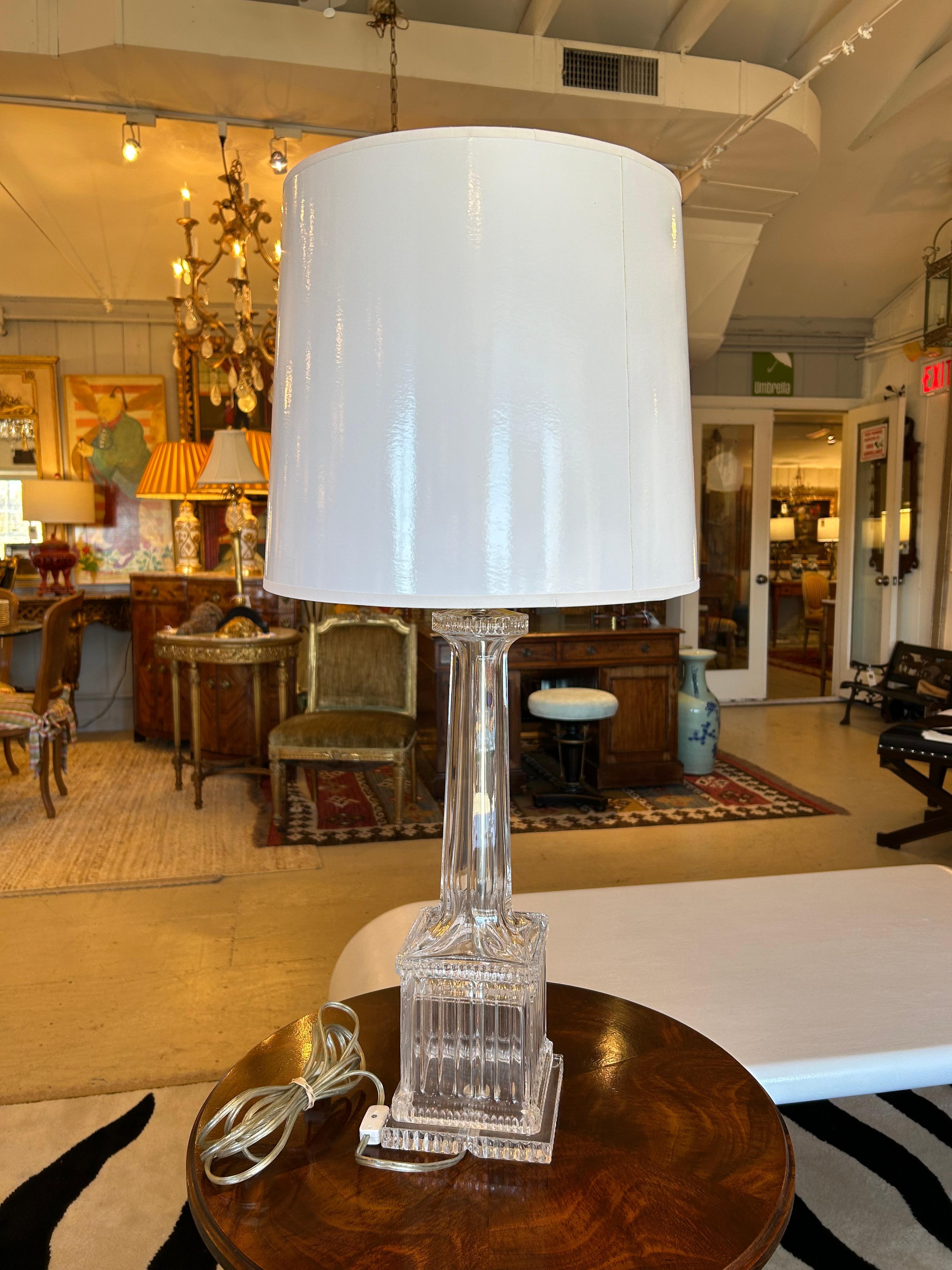 Glamorous large fluted glass/ crystal table lamps having an elegant neoclassical feel.  The 2 bulb sockets are adjustable and so is the height of the lamp. The rod can be moved up and down to accommodate different height lampshades. 
Base is 5.5