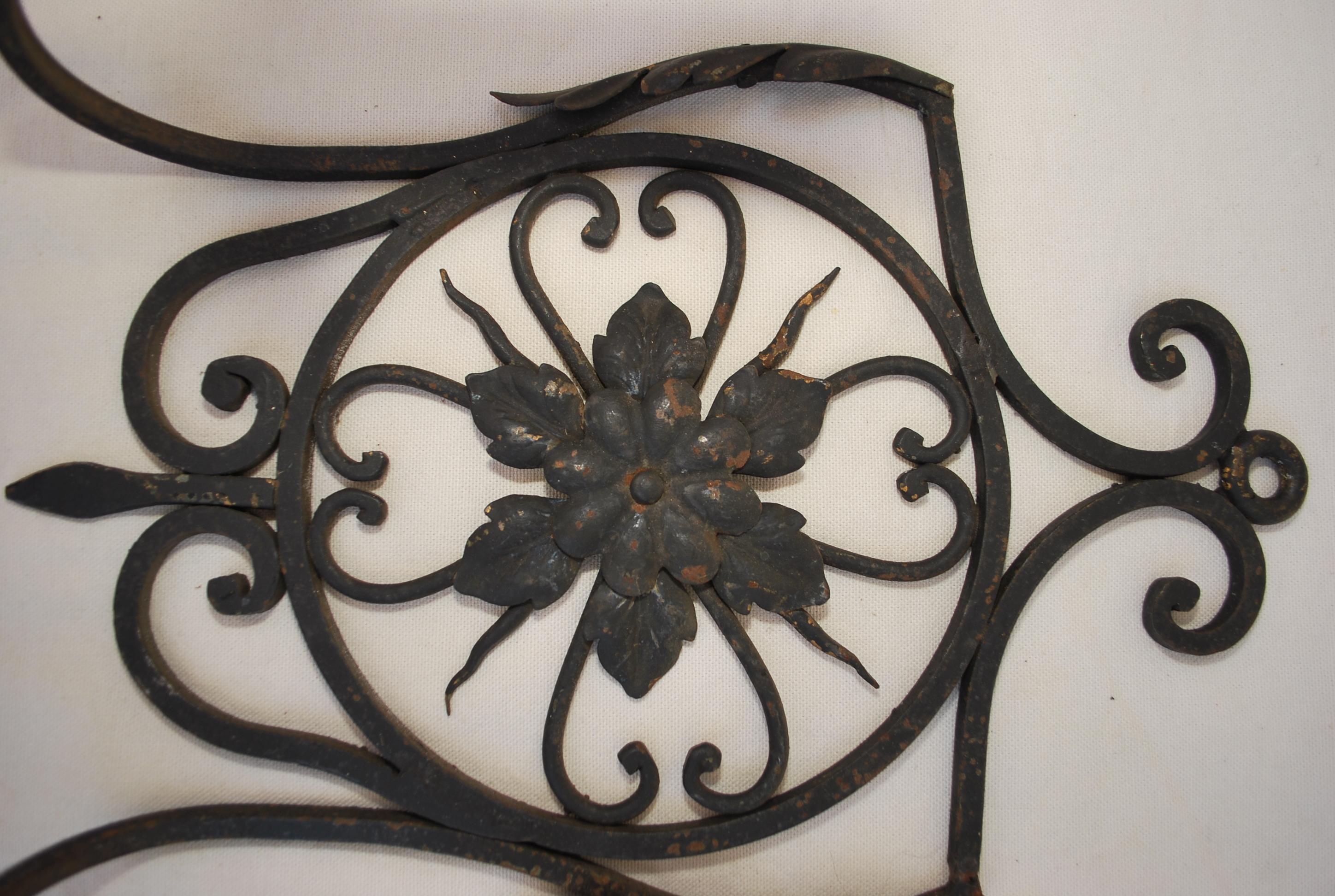 An elegant pair of French hands-forged wrought iron sconces, the patina is allot nicer in person.
