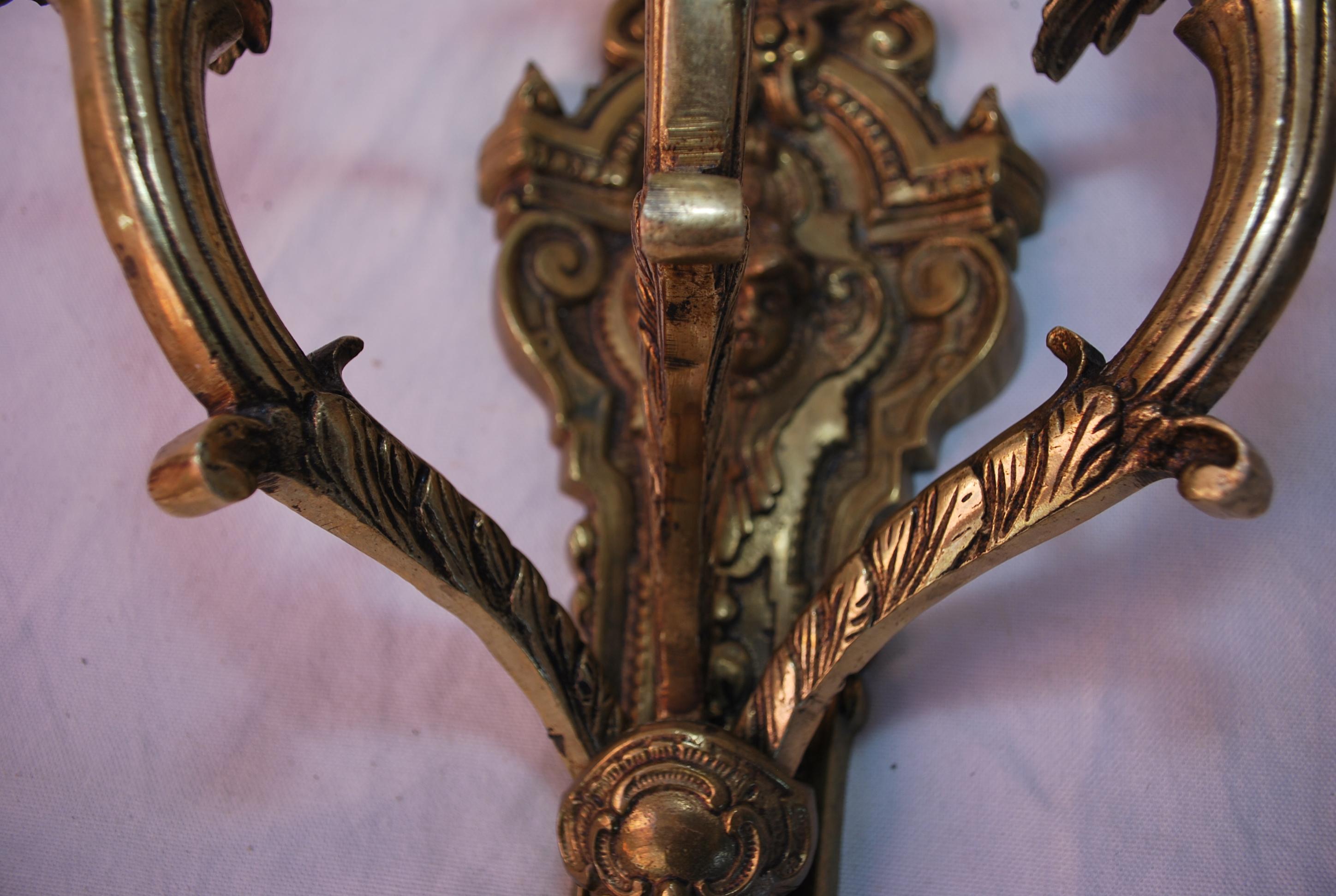 Mid-20th Century Elegant pair of French 1940's Brass sconces with cupids For Sale