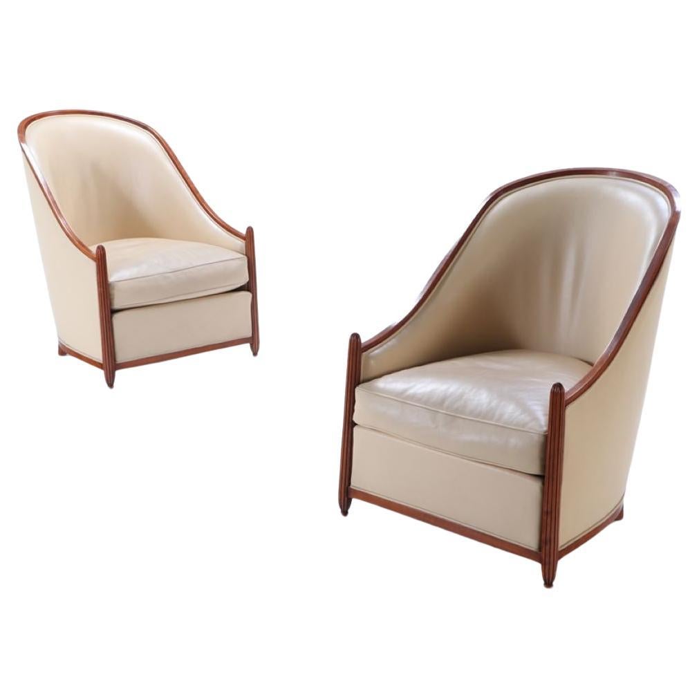 Elegant pair of French Art Deco leather club chairs,  manner of Rhulmann c. 1930 For Sale