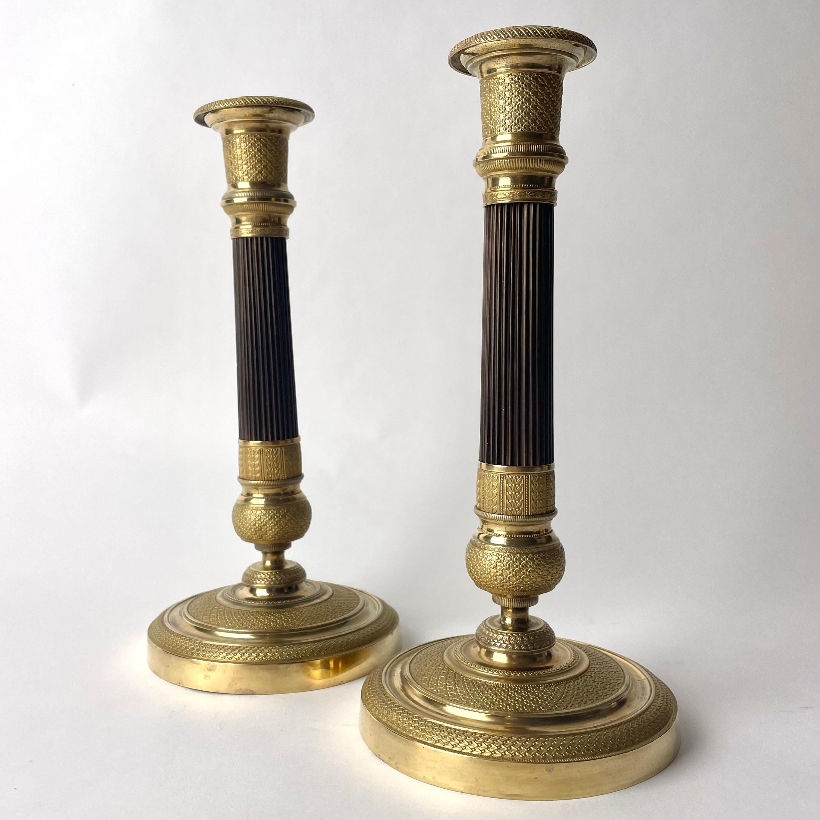 Gilt Elegant pair of French Empire gilt and dark patinated Bronze Candlesticks
