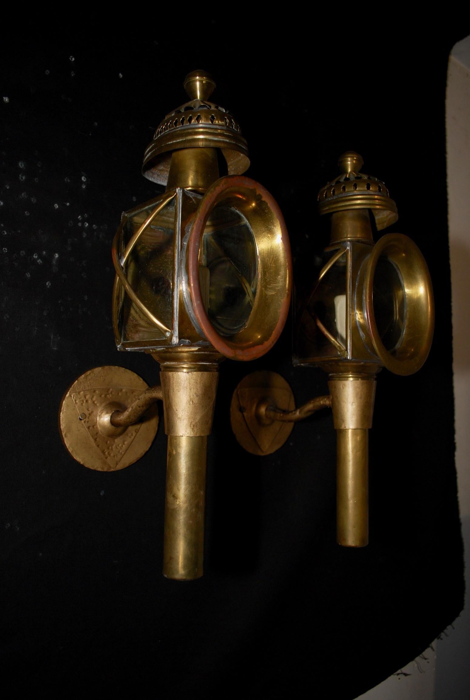 A beautiful pair of turn of the century coach lamps sconces, the patina is nicer in person.

  