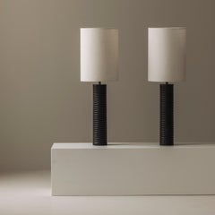 Elegant pair of French wooden carved table lamps from the 1970s.