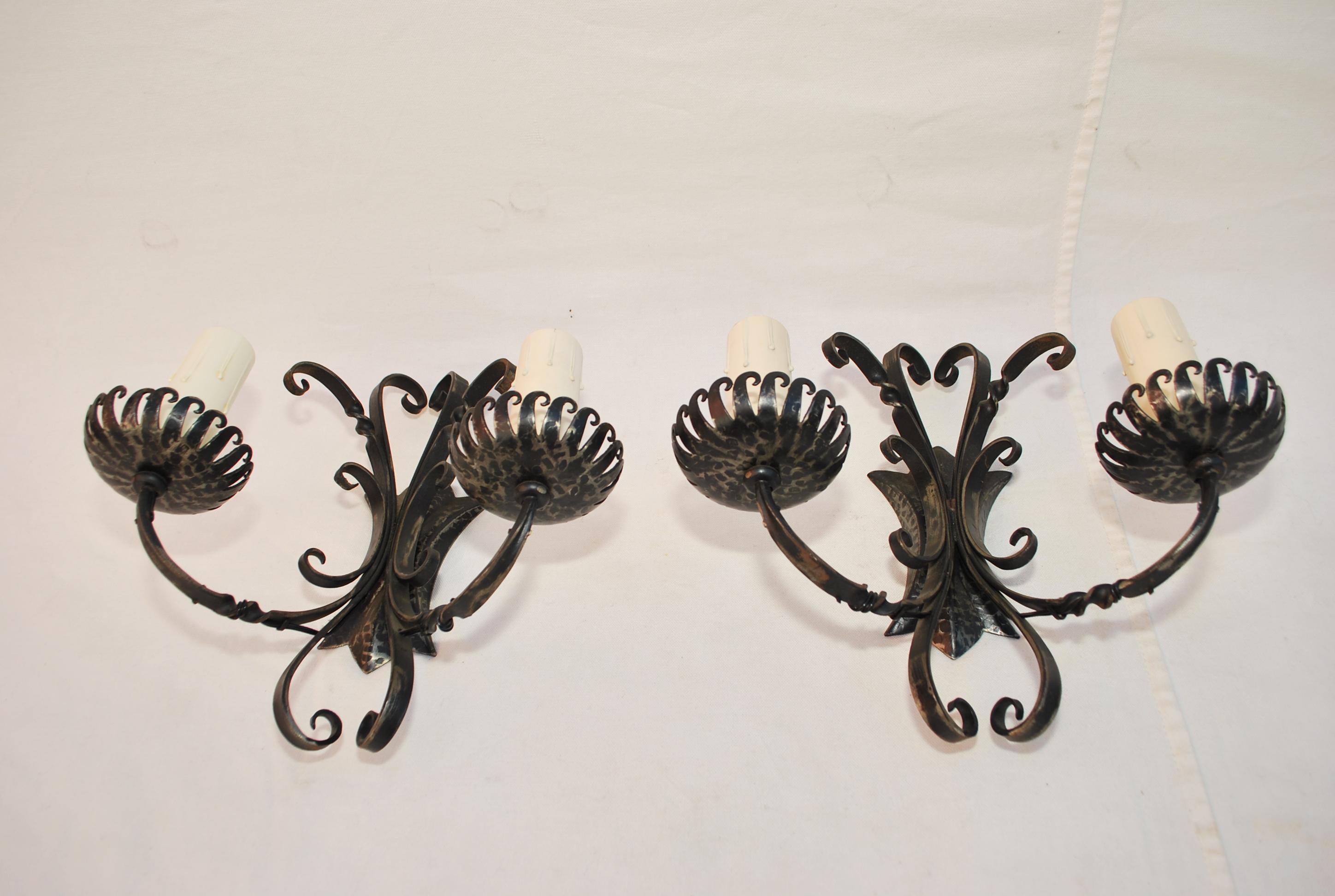 A beautiful  and elegant pair of all hands hammered iron sconces, the patina is much nicer in person, if it is necessary , we can put a back plate to cover the electric box 