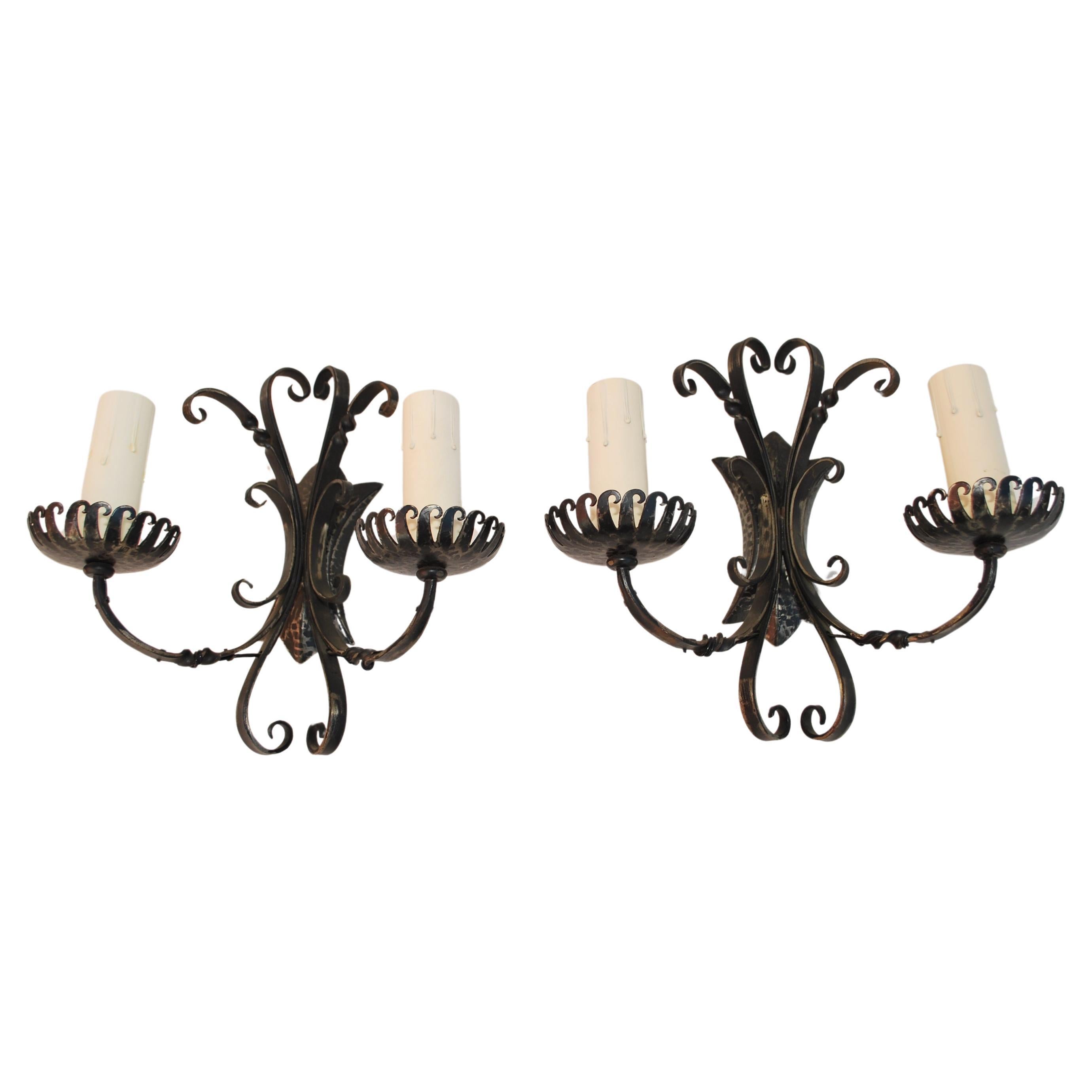 Elegant pair of French wrought iron sconces For Sale