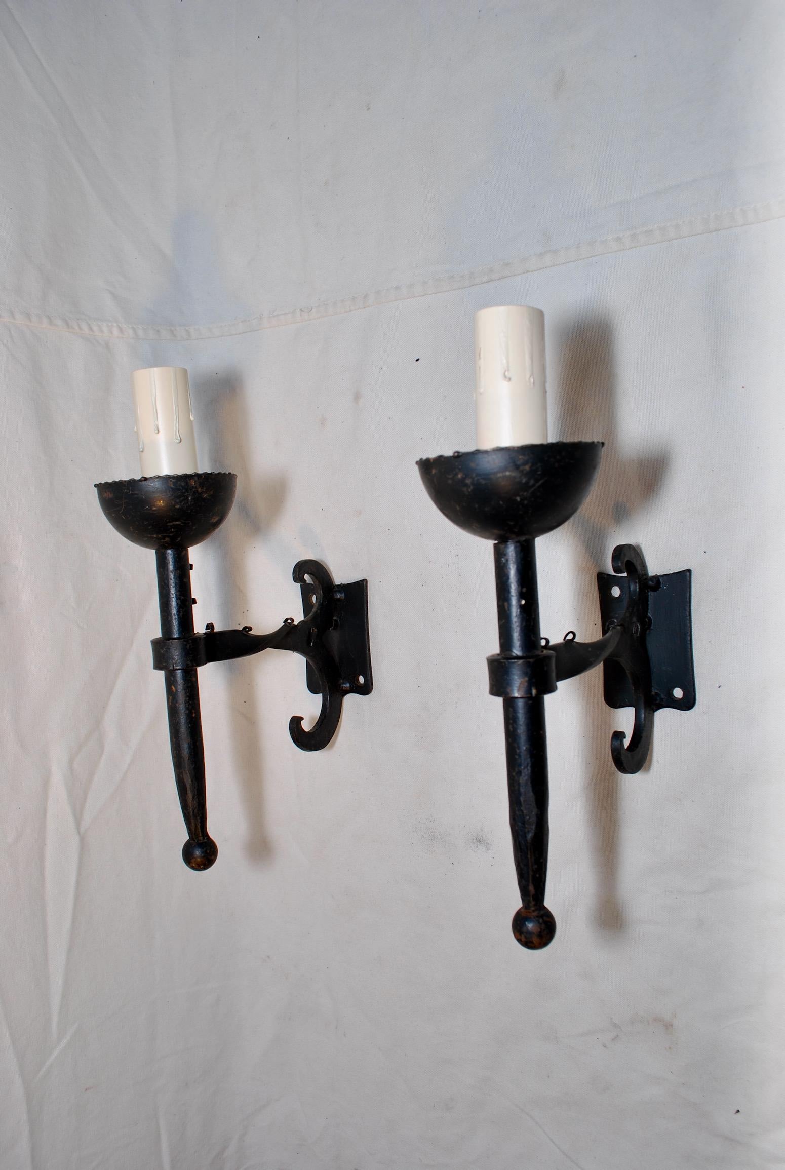 A very nice pair of French 1930s all hands made wrought iron sconces, the patina is much nicer in person.