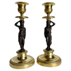 Elegante pareja de Candeleros Dorados con Cariátides. Imperio francés, hacia 1820