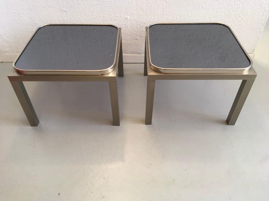 Elegant pair of tinted glass, brushed steel and chrome side tables.
Reminiscent of the Maria Pergay's work.
Good vintage condition
Measures: 48 x 48 x 37 cm.
 