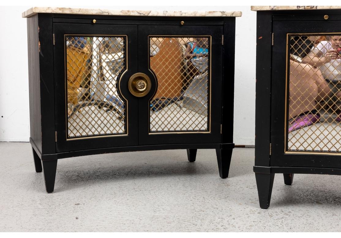 An exceptional Pair of Ebonized door stands with Mirrored Gilt-Tone Grid and Mirrored Doors, Embossed Green Leather Pull-Out Returns and Colorful Marble Tops. The doors open to a space with a single shelf and both Marble tops and Grid Doors have a