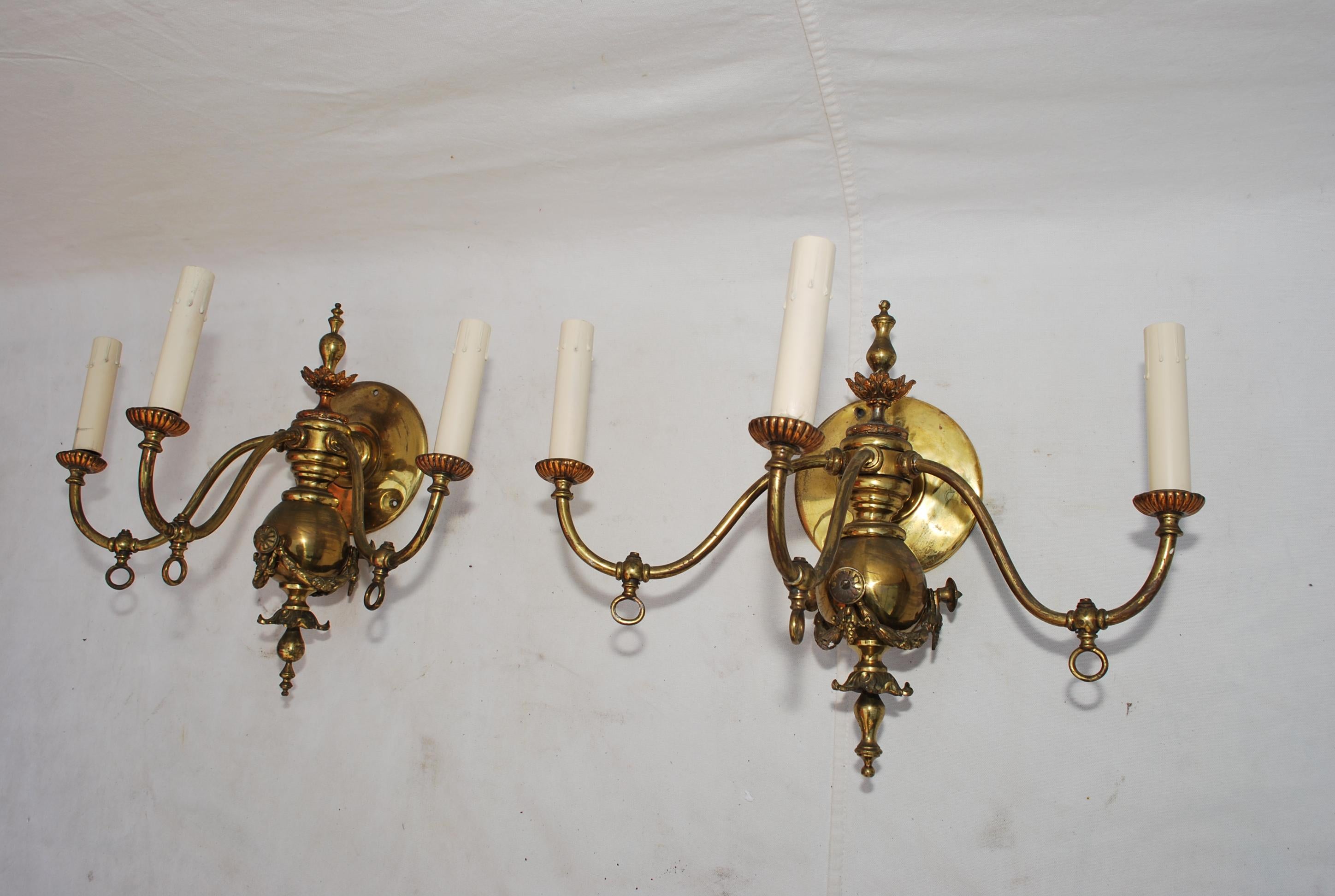 A beautiful pair of late 19th century sconces, originally they were gas, but have been converted to electricity, the patina is much nicer in person, underneath of each arm, you can see the key ring were they used to turn the gas on and off.