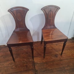 Elegant pair of Late Georgian mahogany Hall Chairs