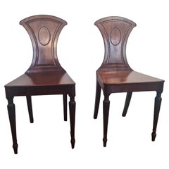 Elegant pair of Late Georgian mahogany Hall Chairs