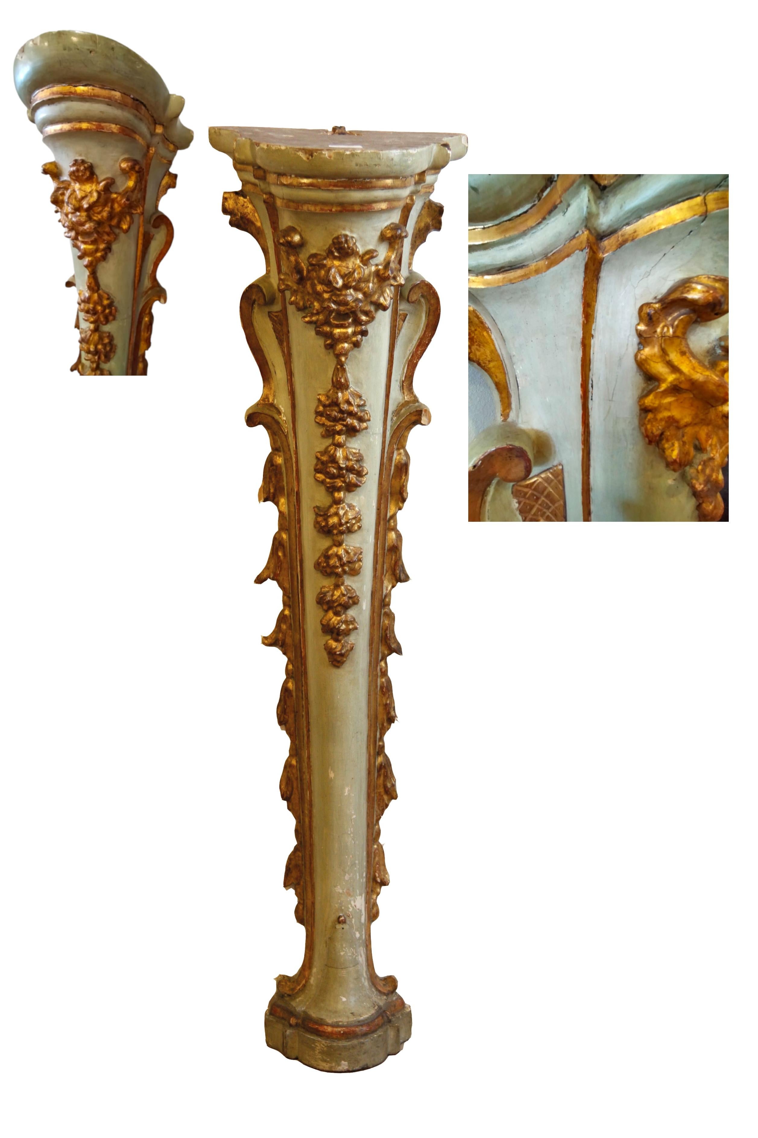 Elegant pair of Louis XV wall columns.

Lacquered and gilded wood with floral carvings and central mask. The lacquered parts of a gray tending to light blue combined with the sculpted and gilded parts contribute to making their slender shape even