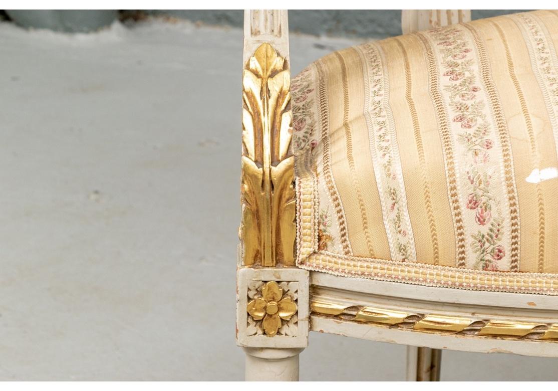 Elegant Pair of Louis XVI Style Painted and Gilt Fauteuils In Distressed Condition In Bridgeport, CT