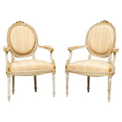 Elegant Pair of Louis XVI Style Painted and Gilt Fauteuils