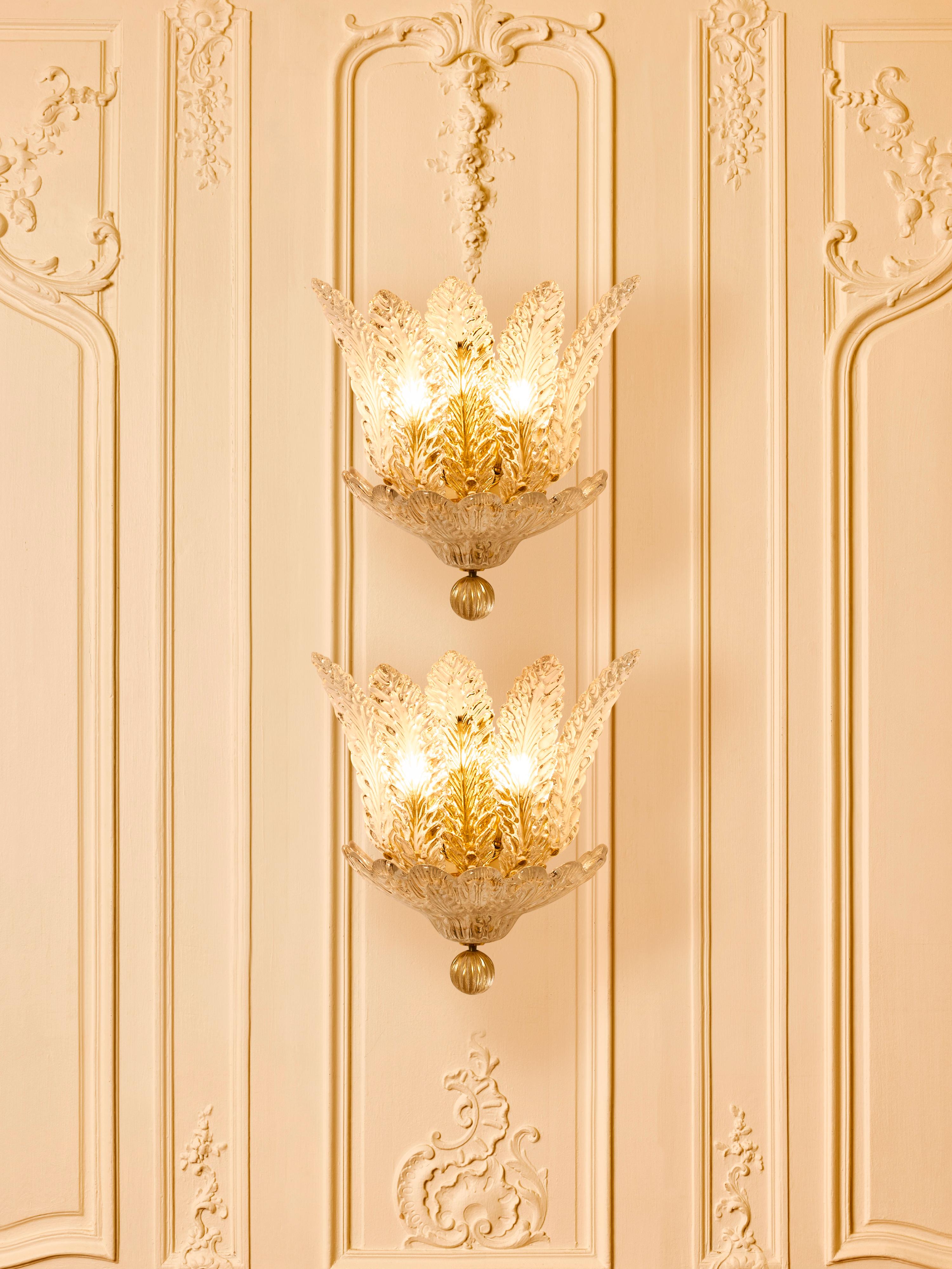 Superb pair of wall sconces in sculpted Murano glass and polished brass.
Italy, 2025.