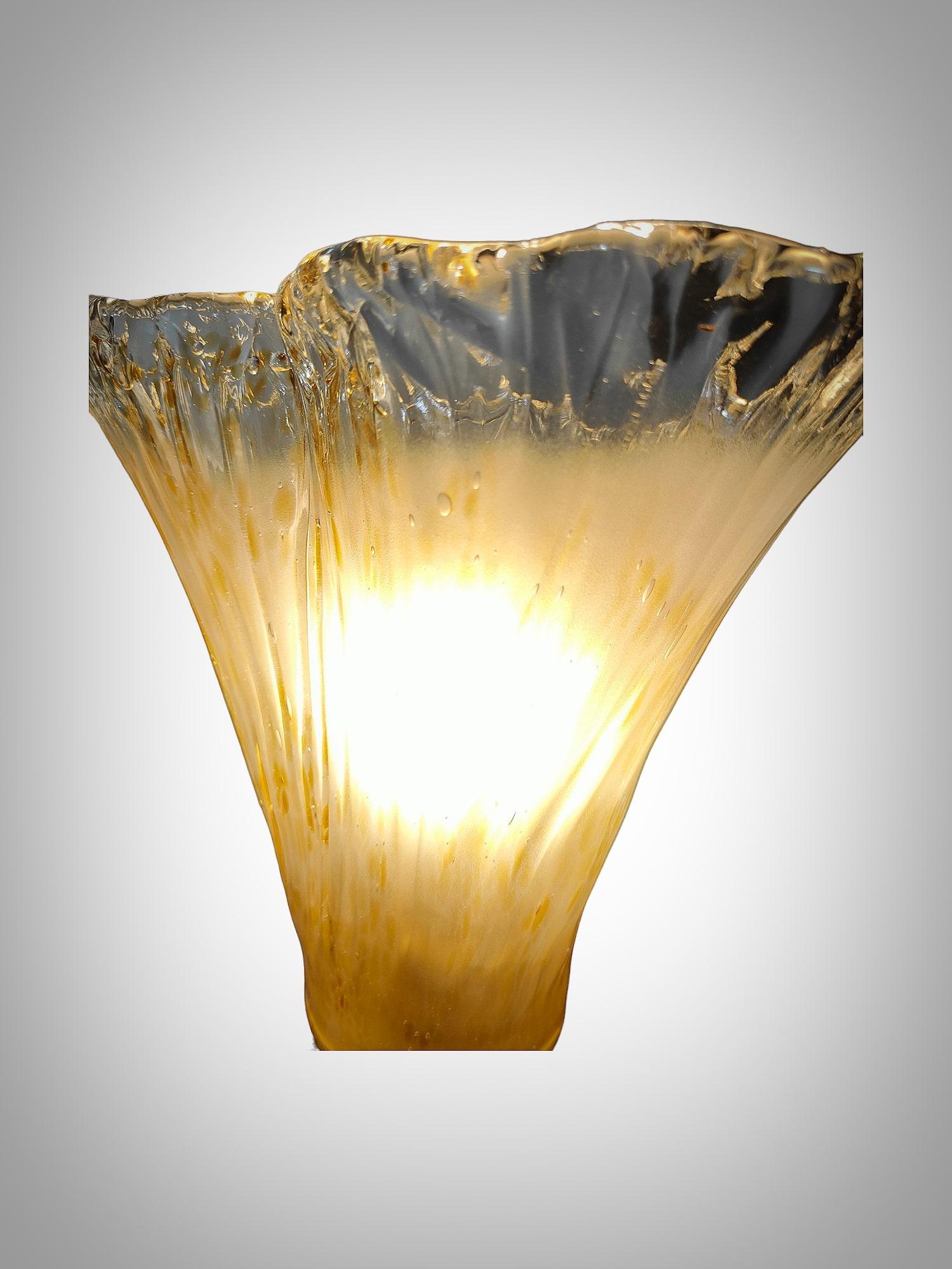 Transform your space with this captivating pair of table lamps, true masterpieces of Murano glass craftsmanship from the glamorous 1970s. These lamps don't just illuminate; they add a touch of luxury and sophistication to any environment.

Key