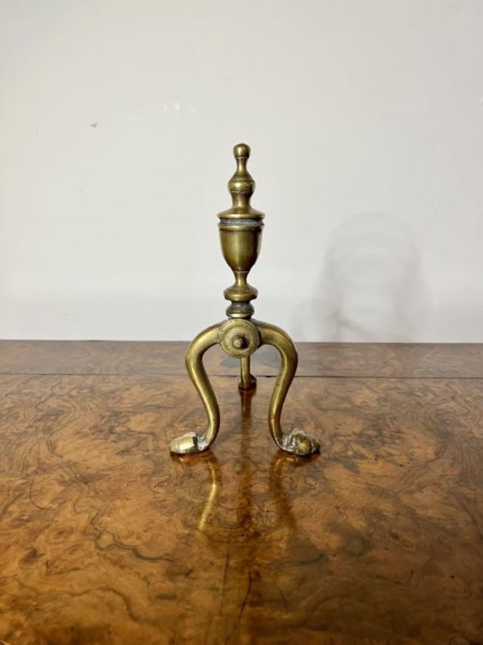 Elegant pair of quality antique Victorian brass fire dogs having a quality pair of brass fire dogs with shaped tops standing on shaped feet.