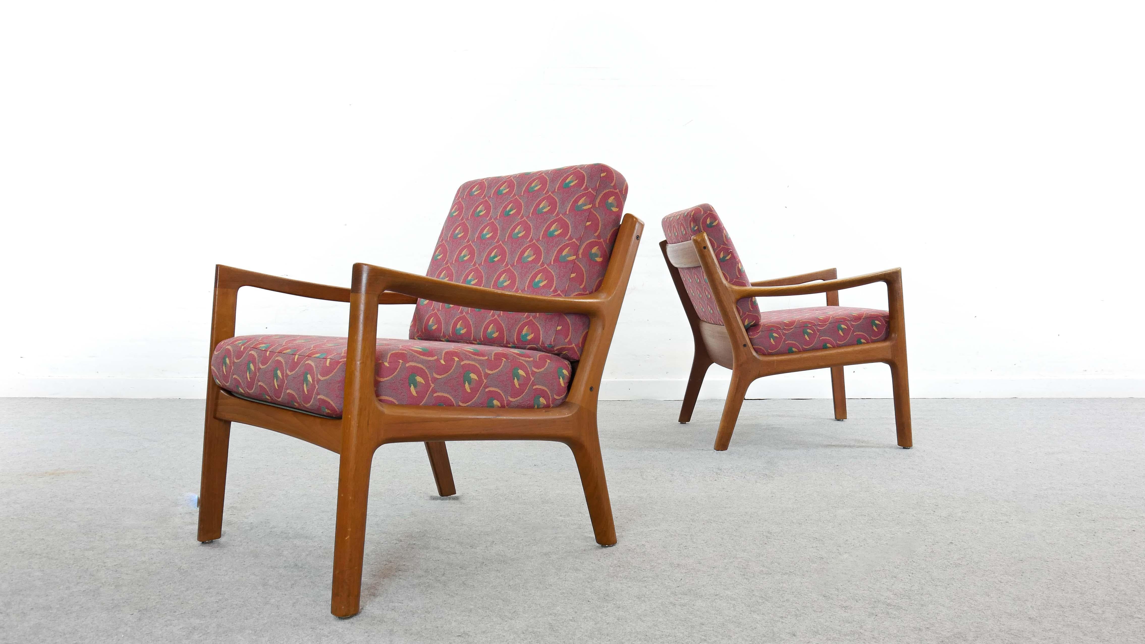 Set of two scandinavian Senator armchairs in teakwood, designed by Ole Wanscher and manufactured by France and Son, Denmark. Cushions have been reupholstered with fabrics by JAB Anstötz.
Manufacturers label underneath.

  