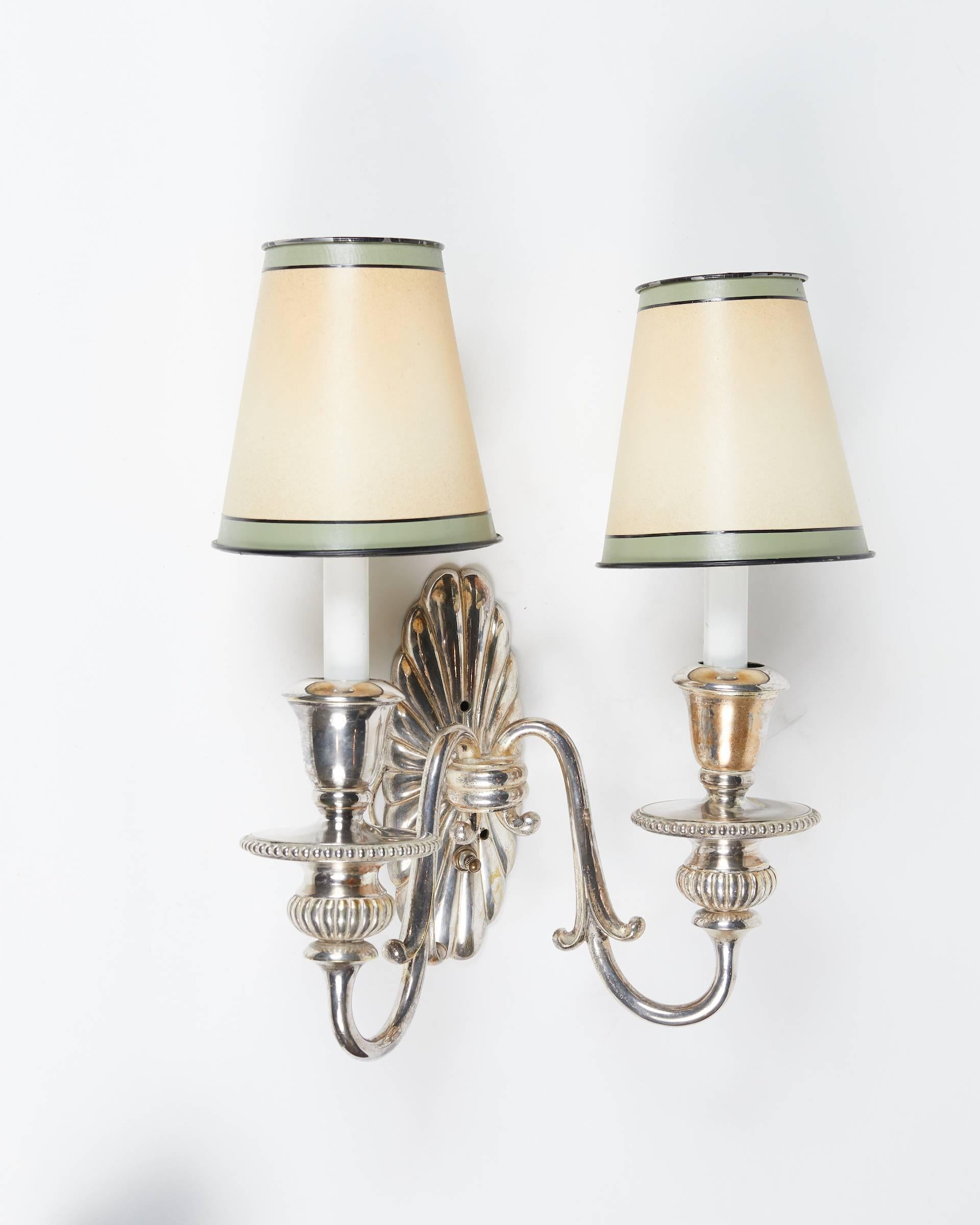 Elegant pair of English silver plated two-arm Adam style sconces.