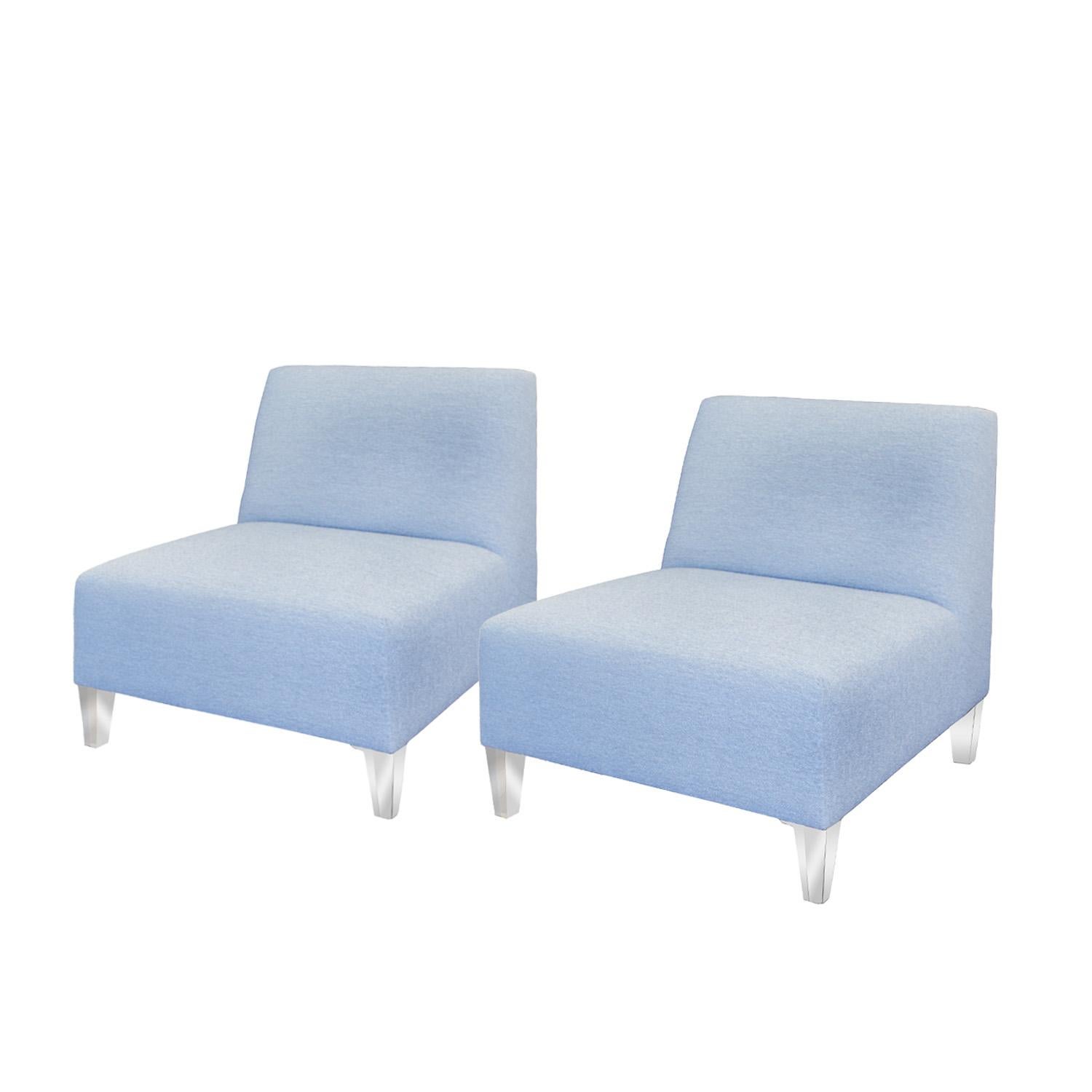 Pair of deep slipper chairs with Lucite legs. Newly recovered in blue boucle by Venfield.