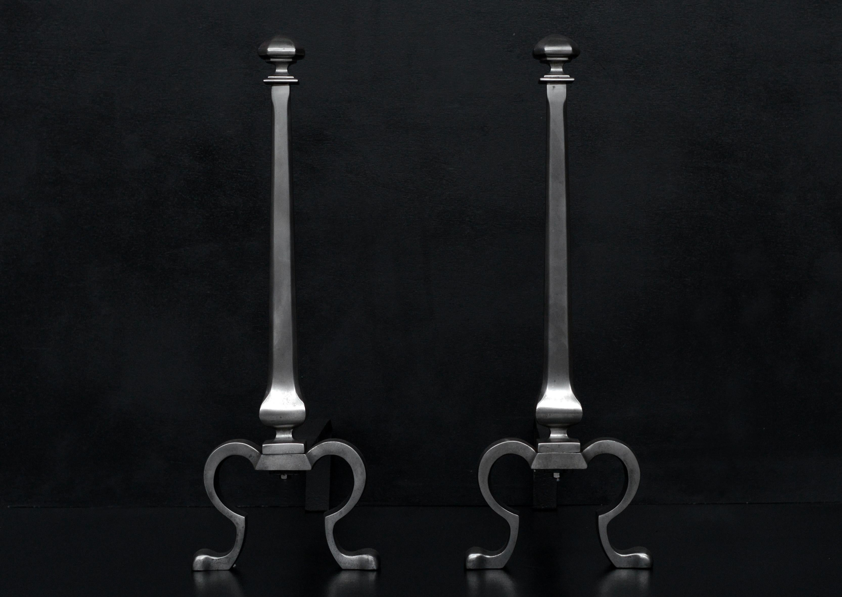 A pair of 19th century polished steel firedogs. The shaped feet surmounted by tapering shaft with square finial to top.


Measures: 
Height:	700 mm      	27 1/2 in
Width:	250 mm      	9 7/8 in
Depth:	510 mm      	20 1/8 in