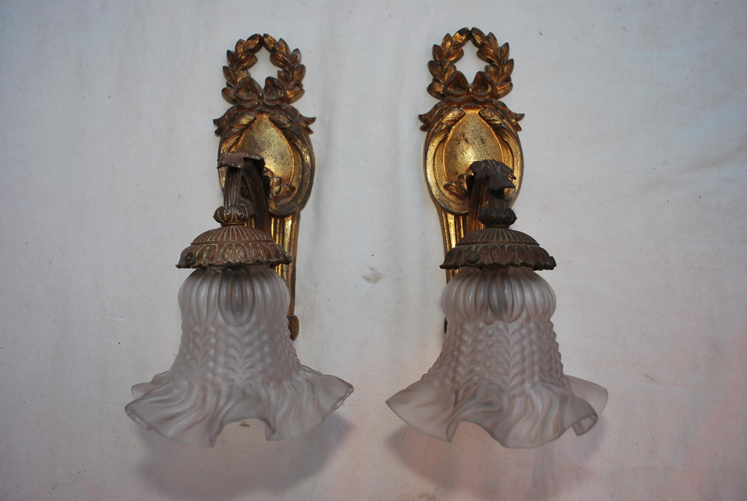 A beautiful pair of french turn of the century bronze sconces, the patina is so much nicer in person, since we are rewired the sconces, we could added a plate in the back if necessary.