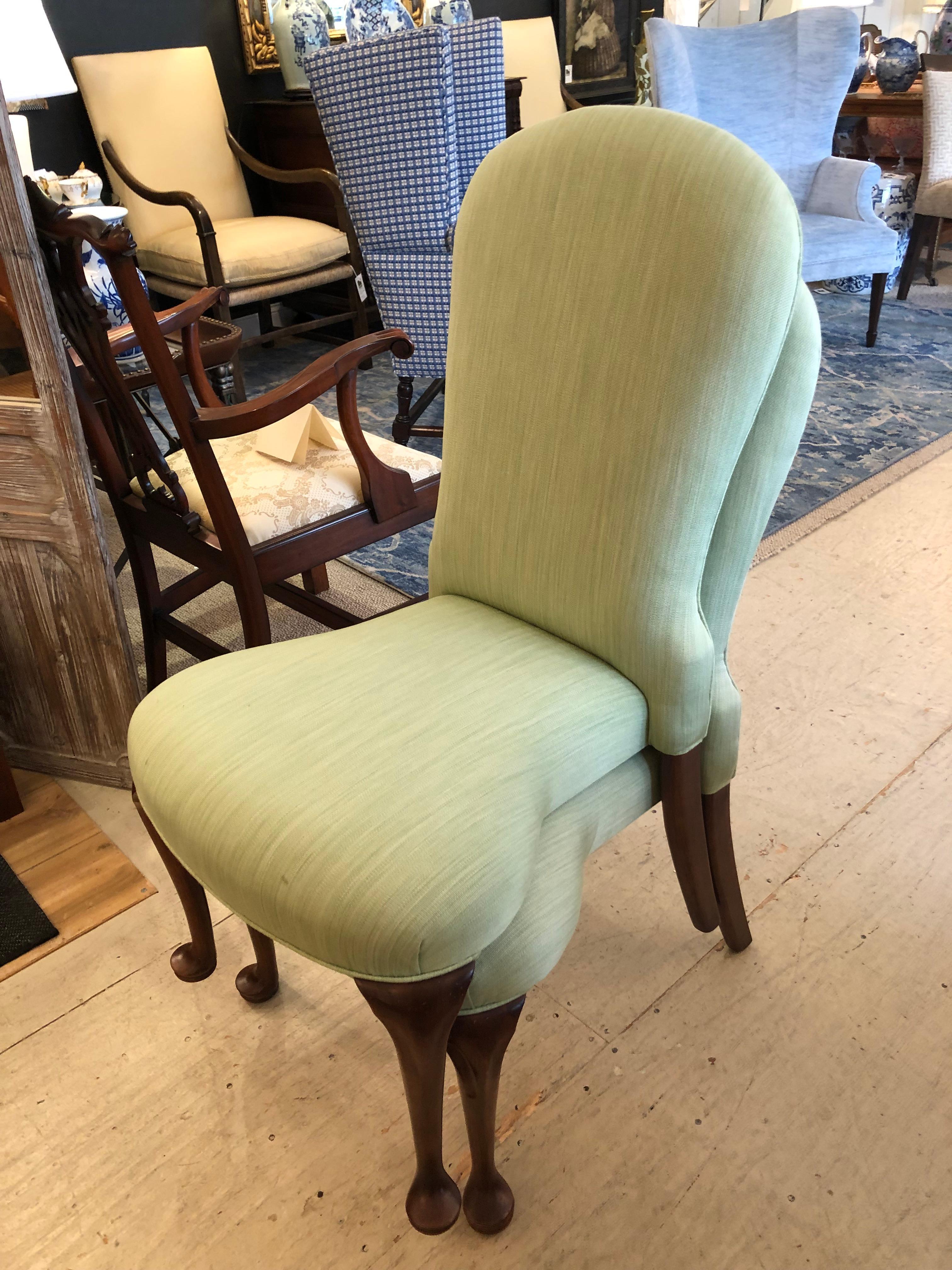 A superb pair of vintage French side chairs with exaggerated shapely seats and backs and dark wood cabriole legs.  A wonderful asset:  they are stackable for easy storage.  