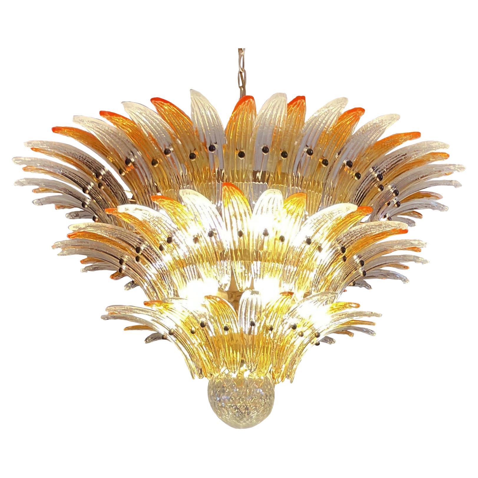 Palmette ceiling light made by 104 Murano clear and amber glasses in a gold metal frame. Murano blown glass in a traditional way. Structure in gold colored metal.
Period:1980's
Dimensions:47,25 inches (120 cm) height with chain; 25,60 inches (65