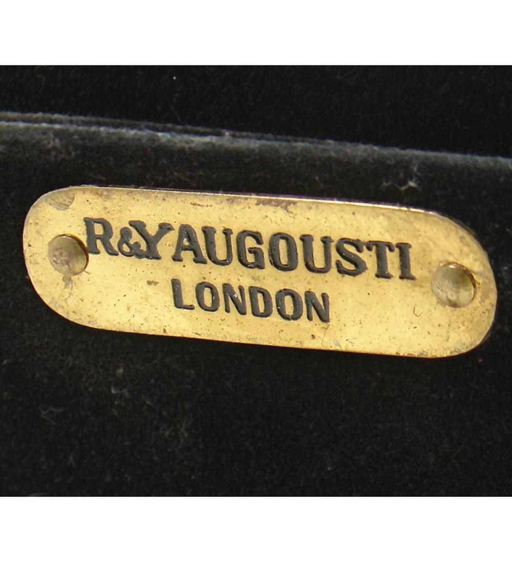 Elegant Parchment Mirror by R & Y Augousti, French, circa 1990s. Beautiful handmade mirror executed in parchment or goatskin. Retains R & Y Augousti brass tag on back. Retains warm original patina. It measures 33.5