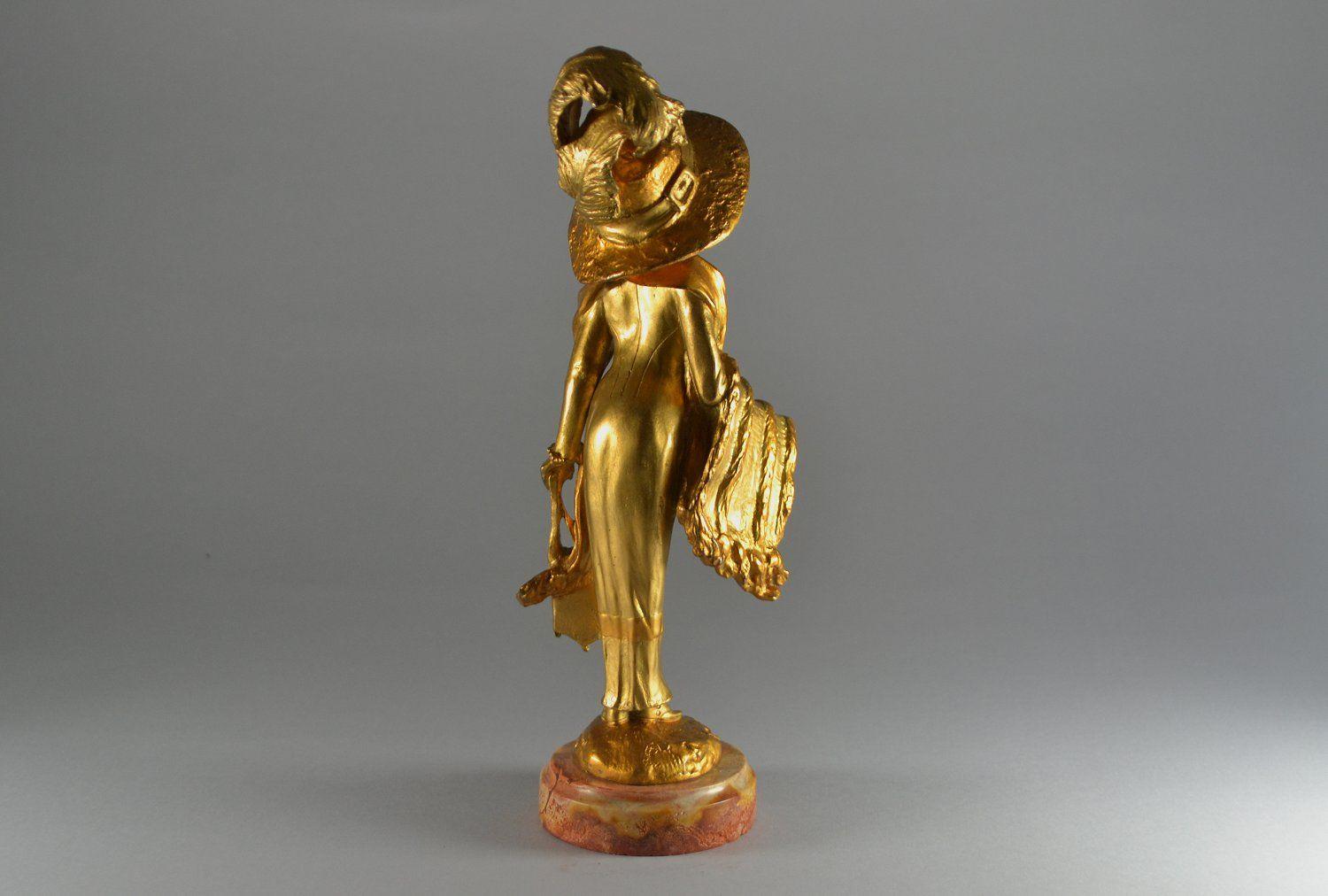 French Elegant parisian lady with a hat. Georges Flamand bronze sculpture