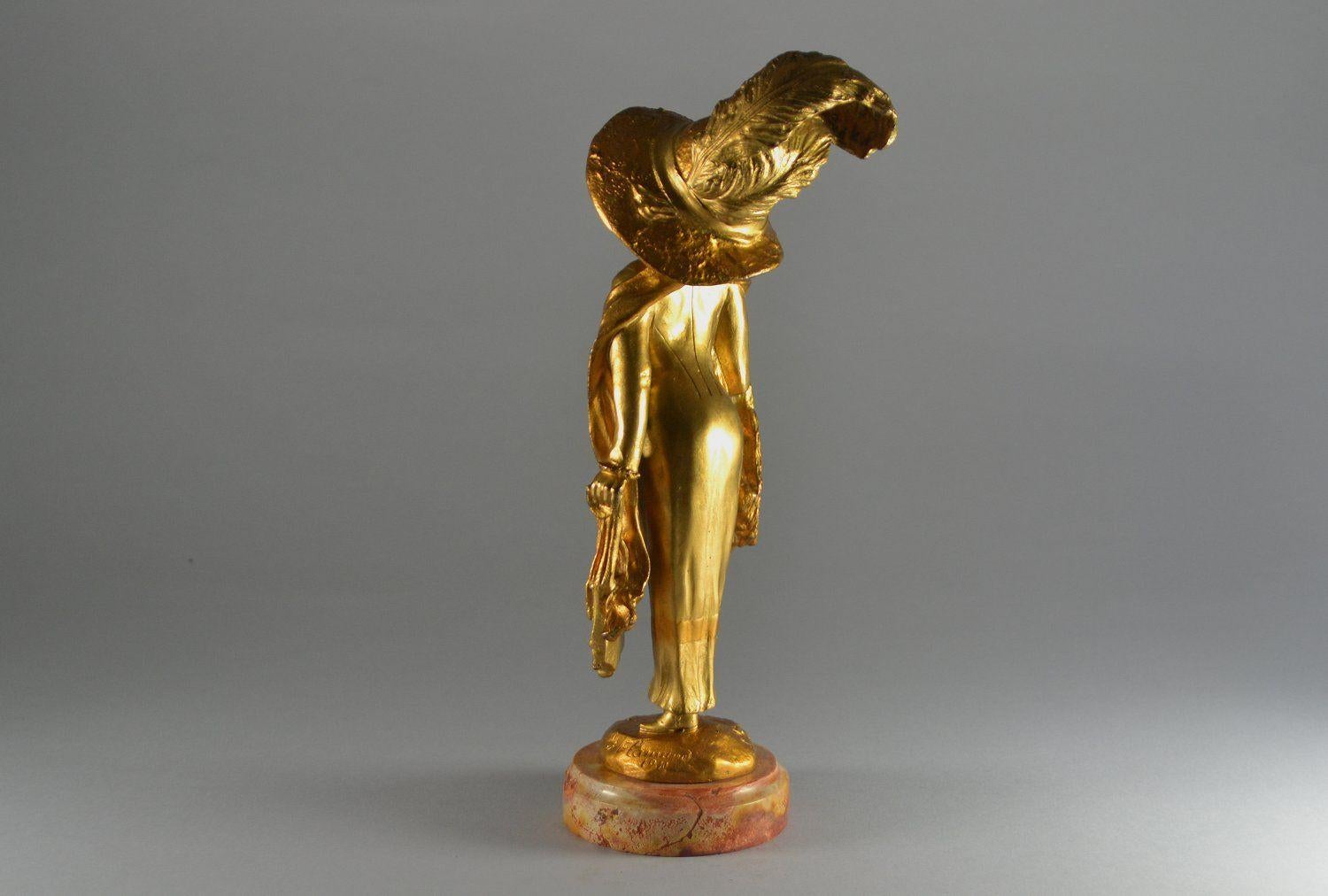 Early 20th Century Elegant parisian lady with a hat. Georges Flamand bronze sculpture