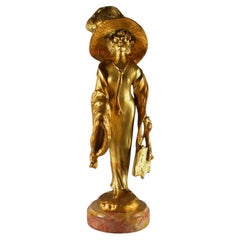 Elegant parisian lady with a hat. Georges Flamand bronze sculpture