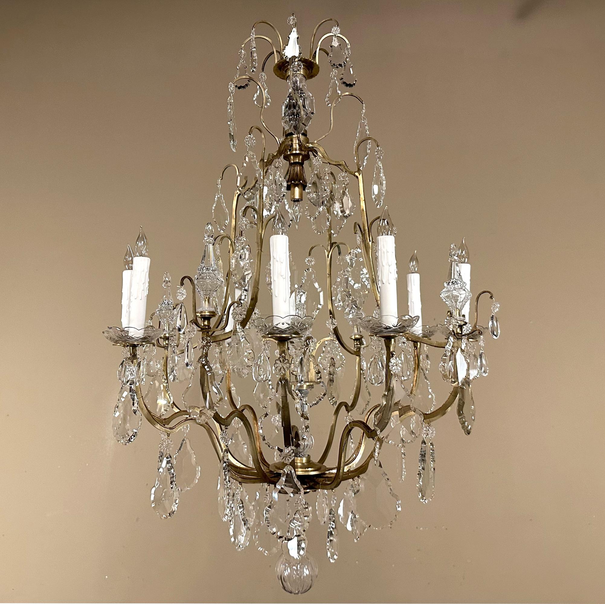 Elegant Parisian Style Brass and Cut Crystal Chandelier was beautifully cast from solid brass just like genuine antique chandeliers, resulting in quality that will last for several homes!  The graceful scrollwork of the brass is lavishly accentuated