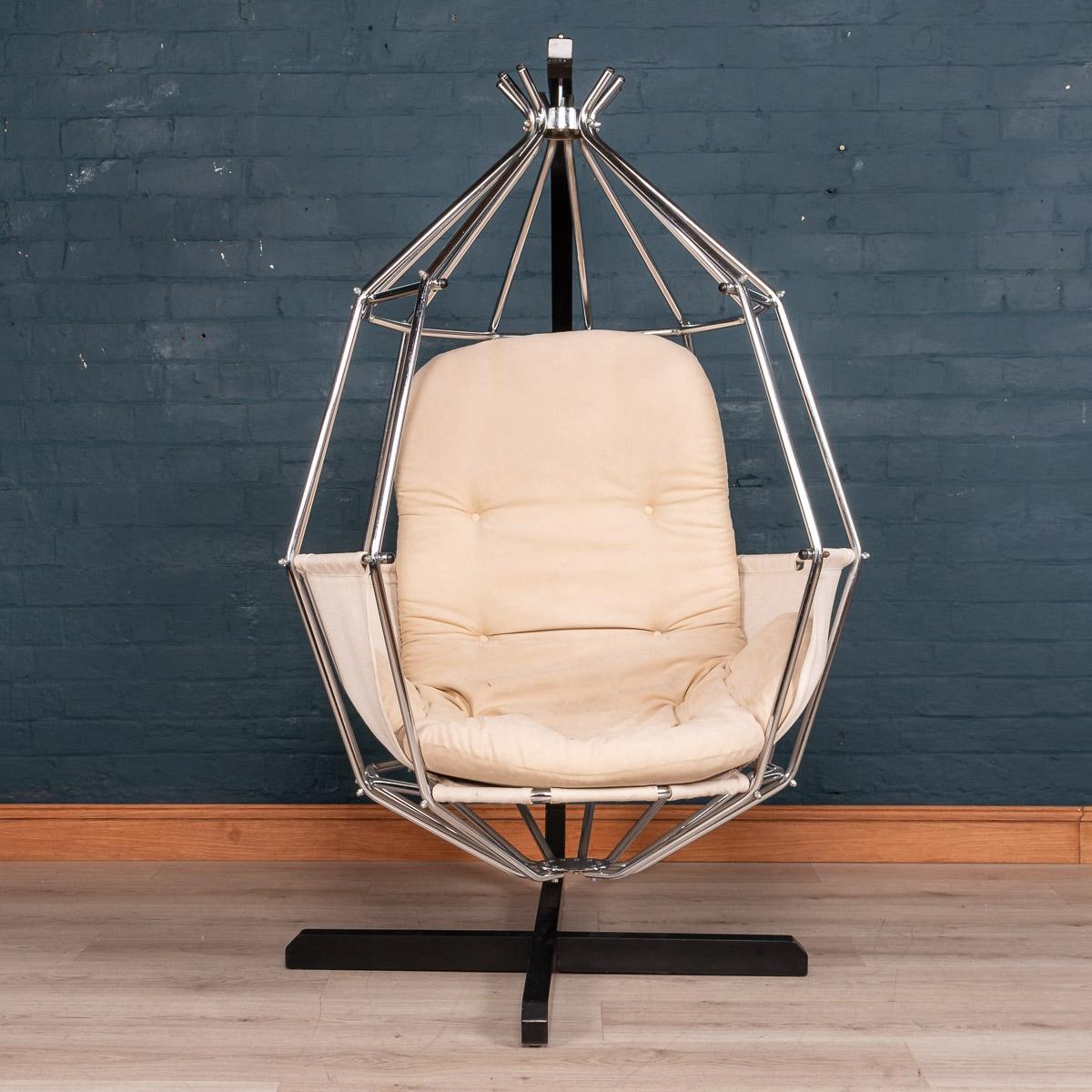 Iconic Swedish Ib Arberg design parrot cage chair, circa 1970-1980. Original cotton canvas upholstery, nickel-plated swing cage with a black enamel steel base.
     
