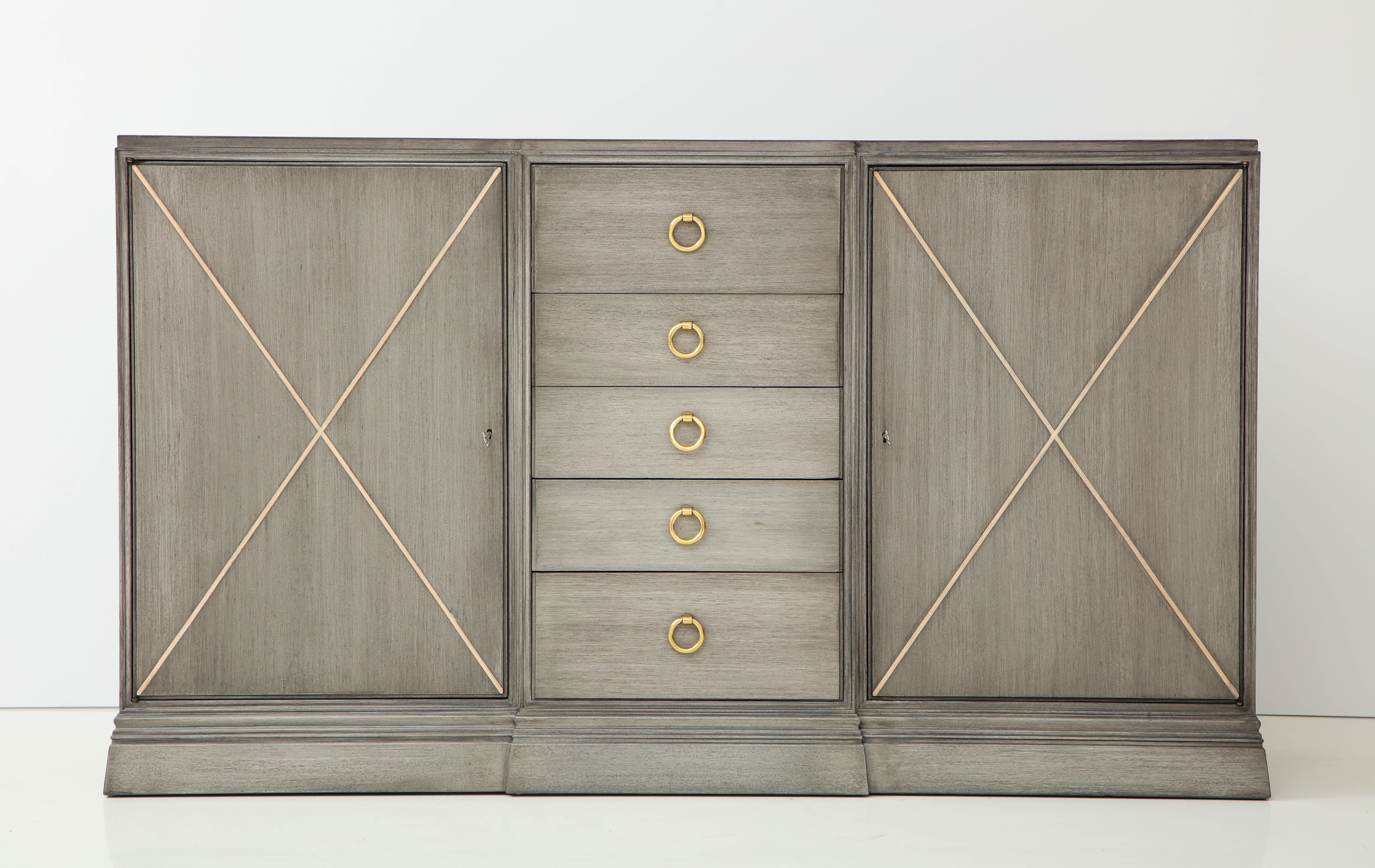Stunning newly refinished Tommi  Parzinger for Charak cabinet.
The cabinet has been beautifully refinished in a soft gray tone with polished brass pulls.
The interior sides of the cabinet have a satin black finish.