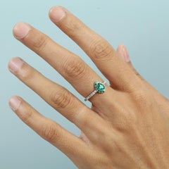 Elegant Pear-Shaped 14k White Gold Emerald Ring with Brilliant Diamond Accents