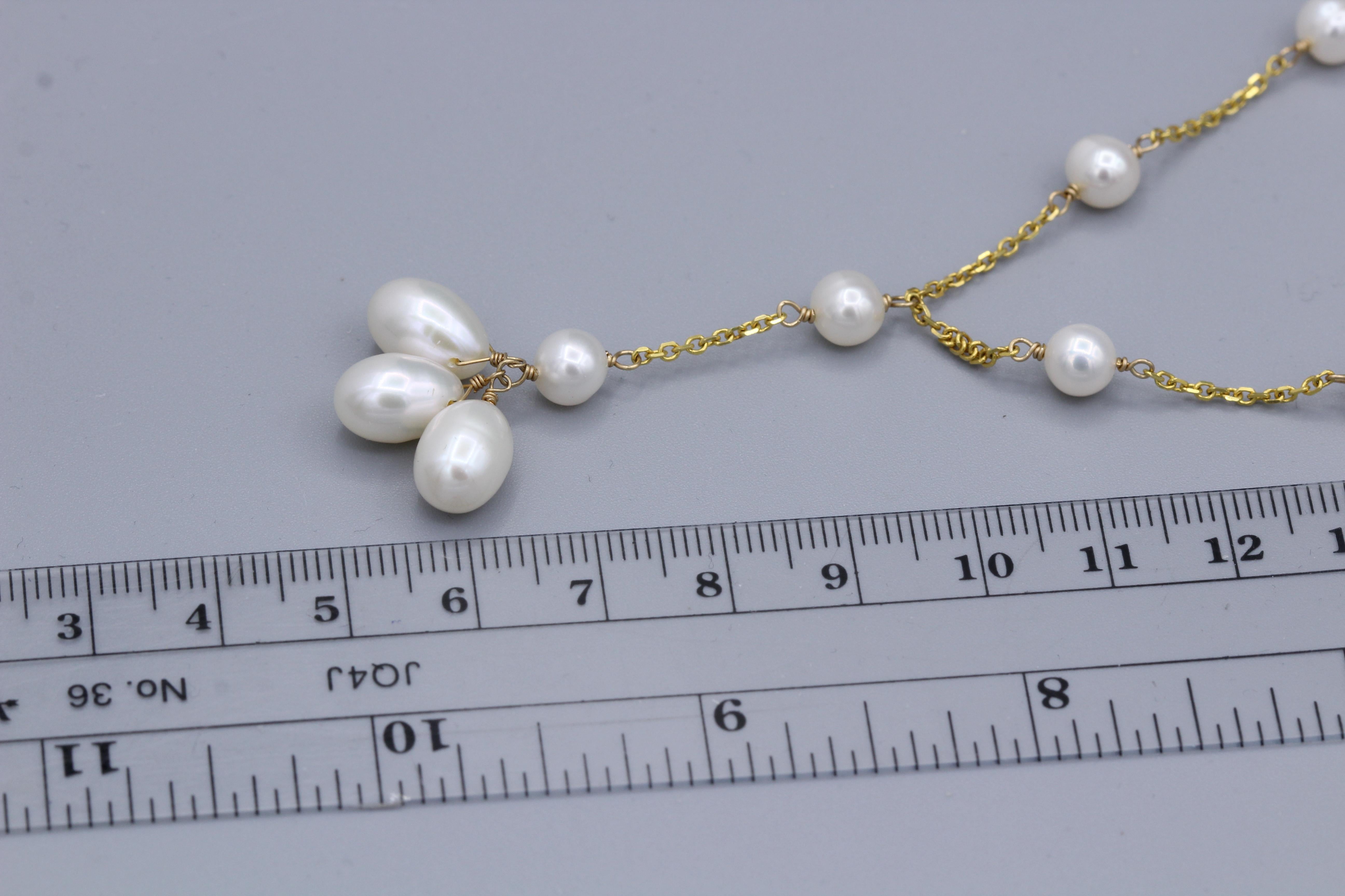 Beaded Pearl Necklace Dangling Wire Style 
14k Yellow Gold
Length 16.5’ Inch
Dangle Length approx. 1.5’ Inch
Fresh water pearls 5.0 mm and oval 7x10 mm
Spring ring lock
Total weight  9.4 grams

