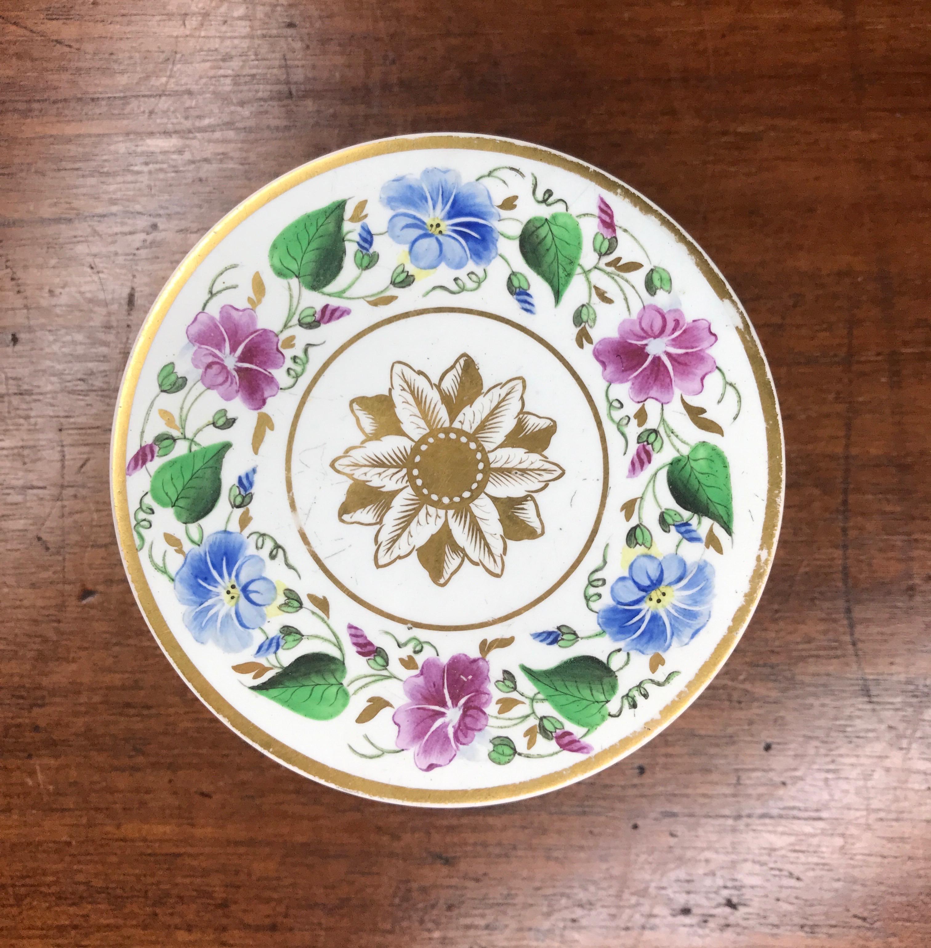 Elegant pearlware box, the circular form well painted with a band of blue & pink convolvulus, around a central classical leaf roundel, the sides with similar decoration between two bands simulating a woven satin ribbon.

Unmarked, possibly