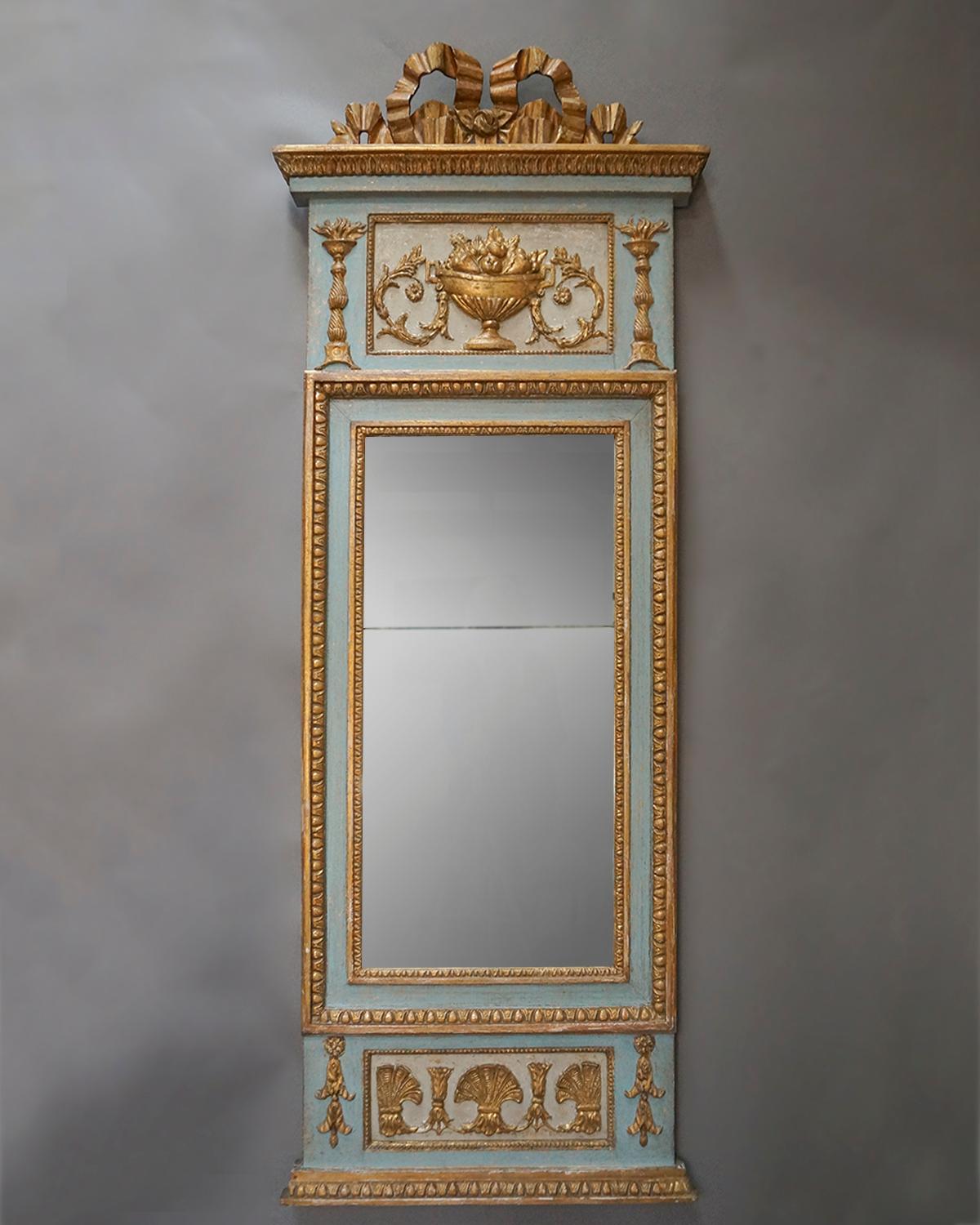 Gustavian pier mirror, Sweden, circa 1790, with original split mercury glass panels. The beautiful frame has a carved bow at the top and panels of gilt elements above and below the glass. Original painted surface and back.