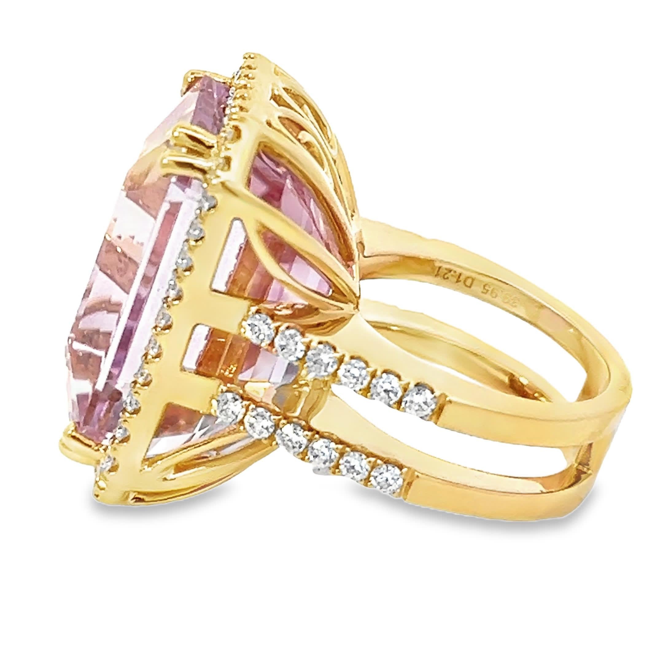 This stunning pink gemstone ring features a large, emerald-cut stone surrounded by a halo of sparkling diamonds. Crafted with precision, it showcases a perfect blend of elegance and modern design, making it a statement piece for any occasion.