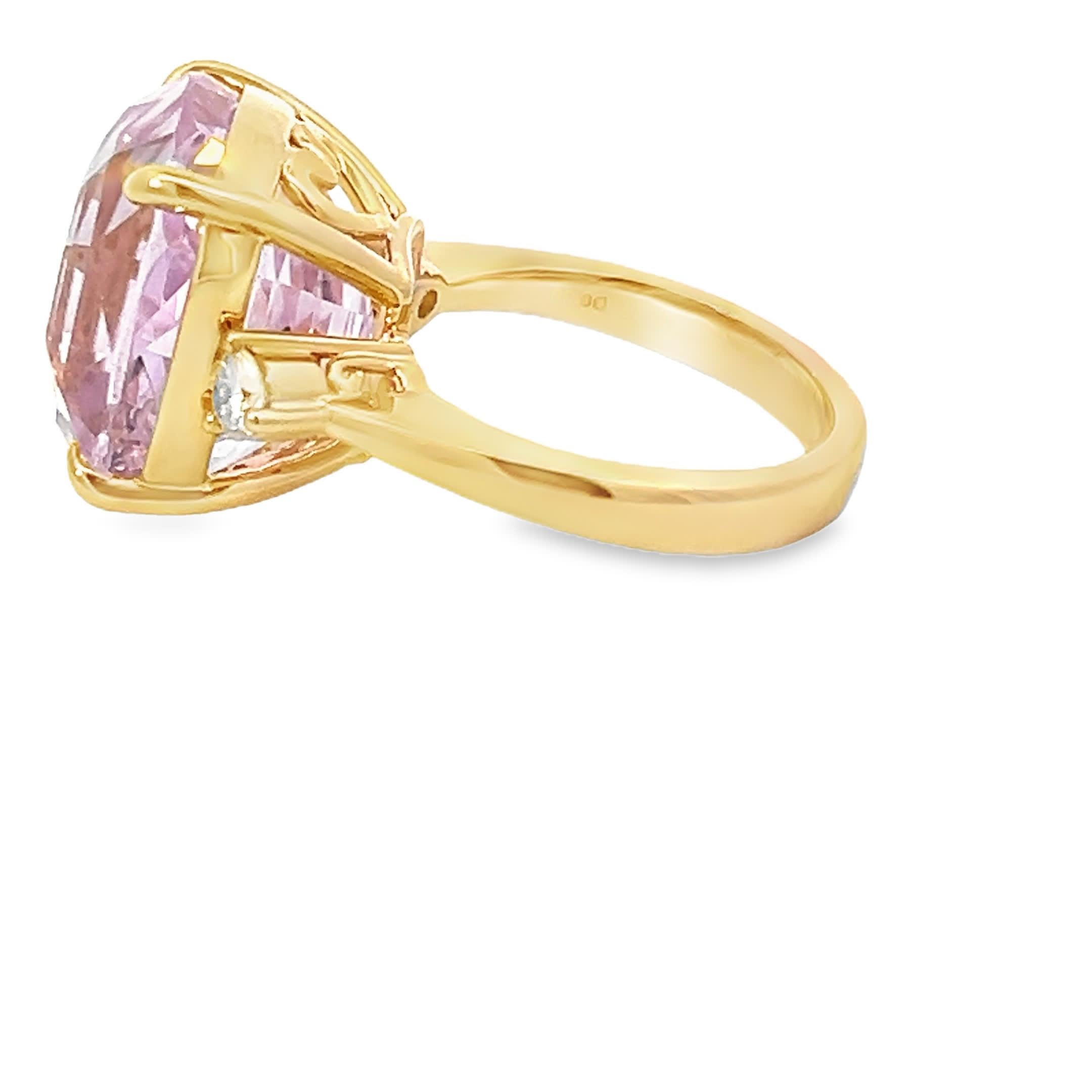 Discover the allure of this stunning pink gemstone ring, featuring a captivating cushion-cut design that sparkles with elegance. The delicate gold band complements the vibrant hue, making it a perfect statement piece for any occasion.