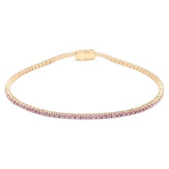 Tennisarmband aus 14-karätigem Gelbgold mit einem rosa Saphir (3 Karat)