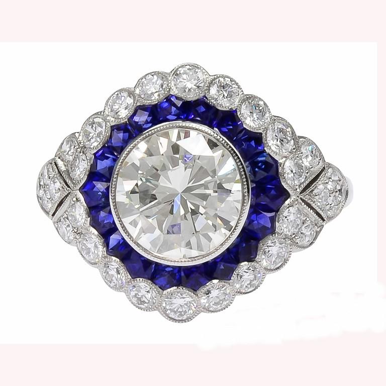 1.92 carats center round diamond with blue sapphires with the weight of 0.95 carats and small diamonds with the total weight of 0.73 carat set in platinum.

Sophia D by Joseph Dardashti LTD has been known worldwide for 35 years and are inspired by