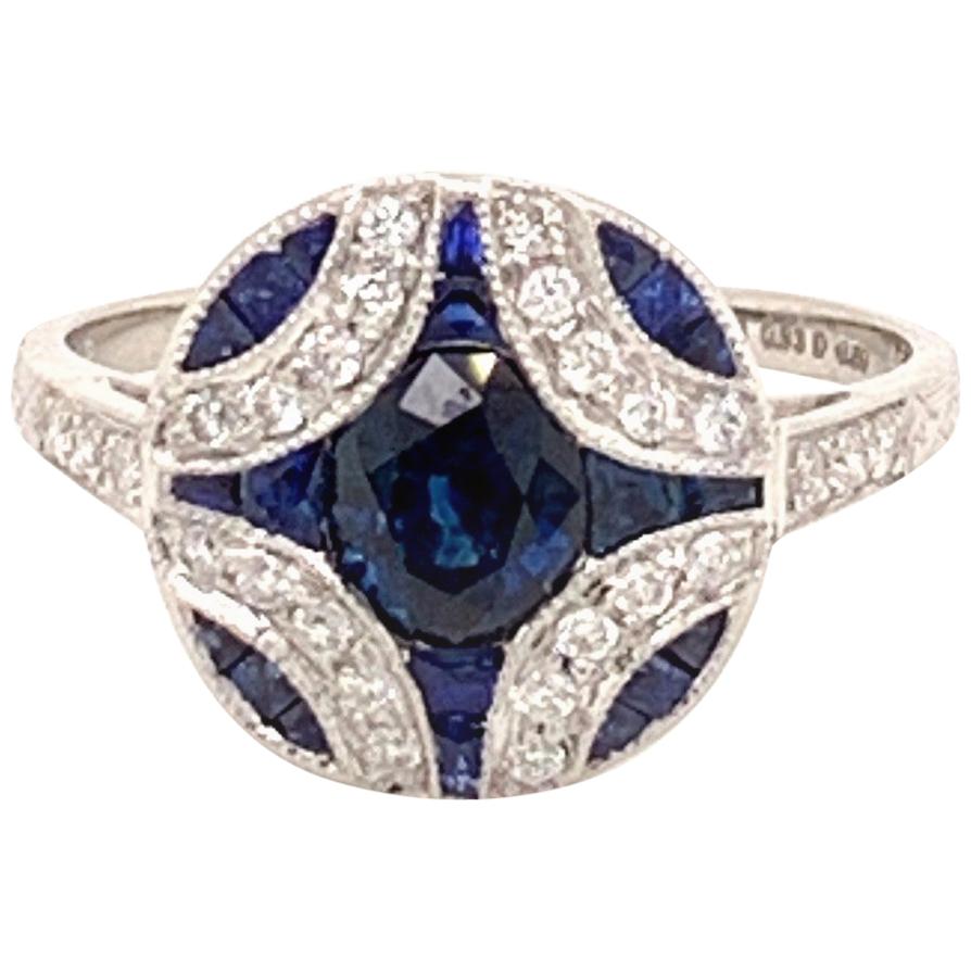 Elegant Platinum and 0.93 Carat Center Round Sapphire Diamond Ring