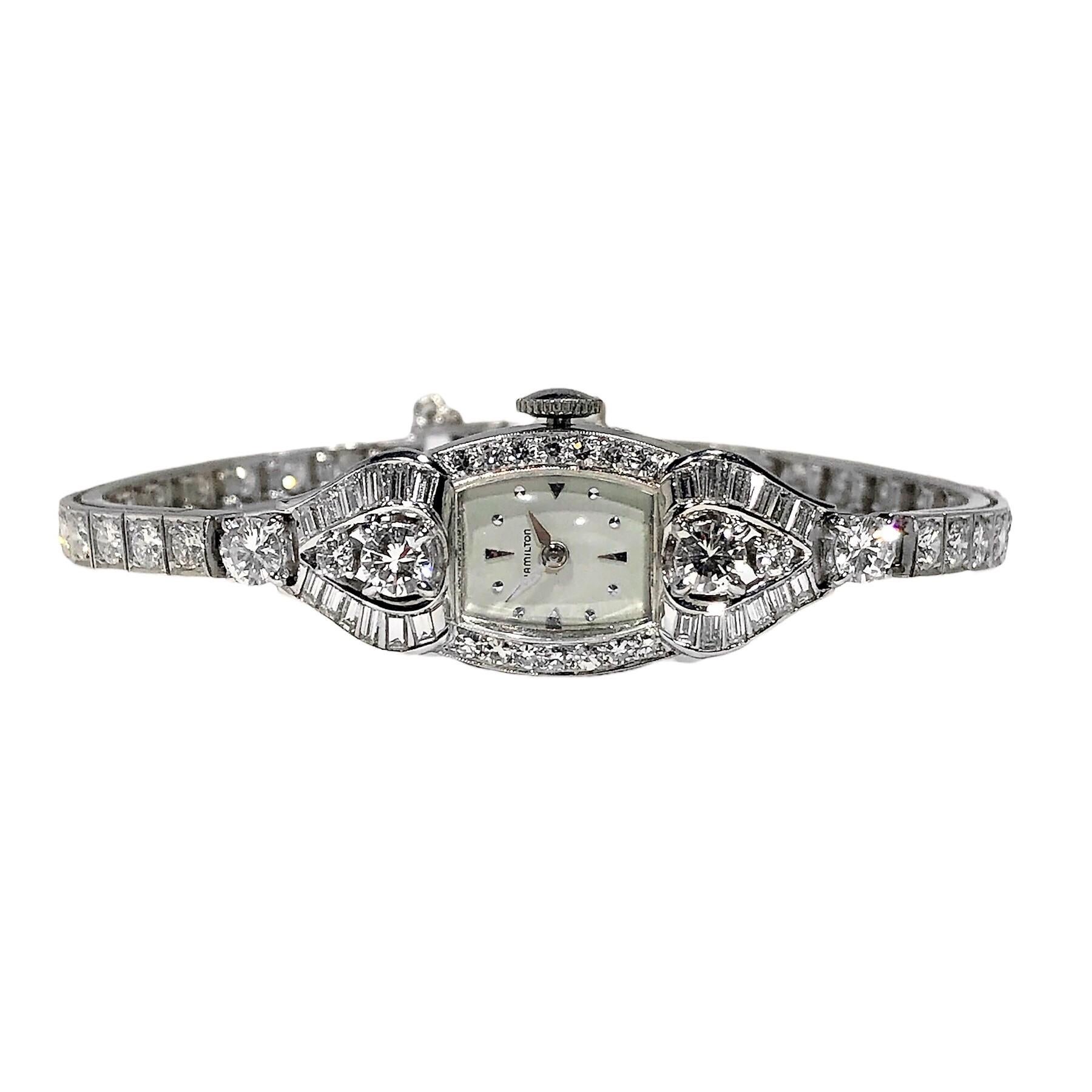 This wonderful creation by venerated American maker, Hamilton, is a pristine example of this Mid-20th Century genre, ladies cocktail watch. Crafted from platinum and replete in watch head and band with brilliant cut and baguette diamonds, it is as