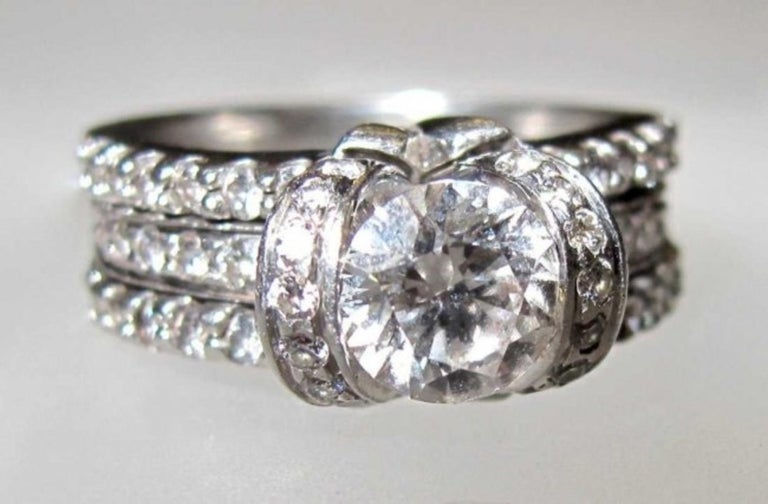 Elegant Platinum and Diamond Bow Ribbon Ring by Tiffany and Co at