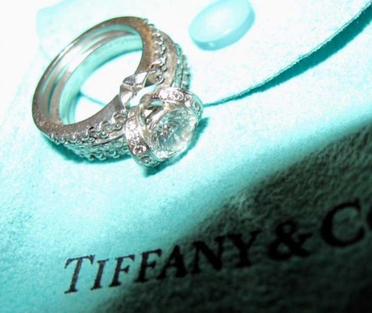 Elegant Platinum and Diamond Bow Ribbon Ring by Tiffany and Co at