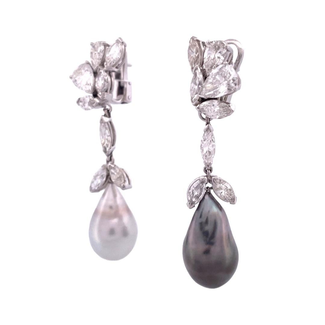 Elegant Platinum Diamond Dangle Earrings



Elevate your style with these exquisite platinum dangle earrings, adorned with a dazzling mix of cut diamonds weighing 7.5 carats. The earrings feature natural side-swept real pearls  as dangles. Crafted